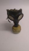 A WWII German Volksgasmaske (silver filter) gas mask, together with a rare East German MEDI gas mask
