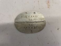 A WWII German Army dog tag. This lot will be available to collect in person 48 hours after the end