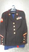 A USMC SNCO's service jacket and trousers. This lot will be available to collect in person 48