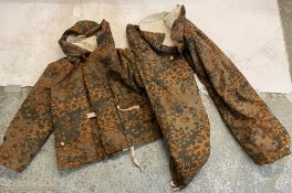 A reproduction SS Autumn camo winter parka and trousers. This lot will be available to collect in