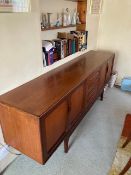 A Victor B Wilkins for G-Plan Mid Century teak 'Fresco' sideboard, fitted with four central drawers,