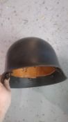A German M53 fireman's helmet.