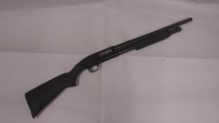 A deactivated (EU Spec) US Mossberg Maverick model 88 pump action shotgun with solid stock and