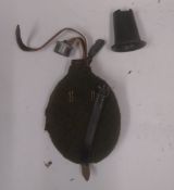 A WWII German military water bottle with reproduction strap.