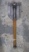 A WWII German folding entrenching tool.