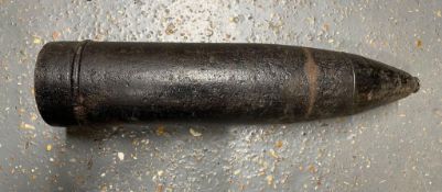 An inert WWII German 7.5cm projectile with fuse.
