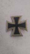 A WWII German iron cross badge bearing mark to pin.