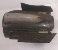 A partial aerial bomb tail section.