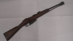 A deactivated (EU Spec) Italian Carano Mosquetto Model 1891 carbine with folding bayonet.