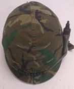 A Vietnam era US M1 helmet with grenade