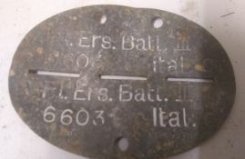 A WWII German dog tag. This lot will