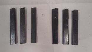 Three lacquered Sten magazines together