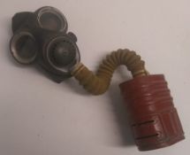 A WWII British gas mask and canvas bag.