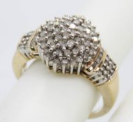 A 9ct gold diamond cocktail ring having large central cluster and encrusted shoulders,