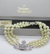 A Vivienne Westwood three row bas relief faux pearl choker, presented in original box,