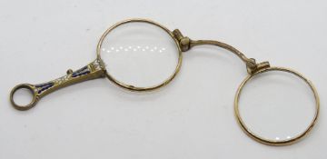 A delightful enamelled set of folding lorgnette glasses.