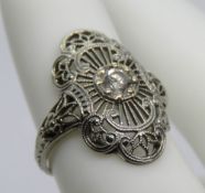 An Art Deco style 18ct white gold ring, central white stone, stamped 18k, size G-H, 2.4g.