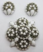 A vintage Warner brooch and clip on earrings costume jewellery set,