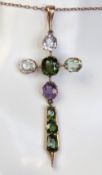 An impressive antique gem set crucifix on 9ct rose gold chain,