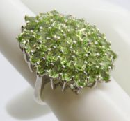 A superb silver and peridot cocktail cluster ring, stamped 925, size L-M.