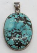 A large turquoise pendant of good teal blue colour with black veining,