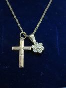 Two yellow metal pendants on a 9ct gold fine link chain necklace,