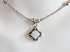An opal and silver bead necklace in the Native American Navajo style, stamped 925 to pendant.