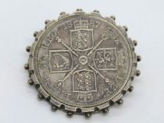 A Queen Victoria 1887 silver crown in swivel brooch mount.