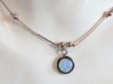 An opal and silver bead necklace in the Native American Navajo style, stamped 925 to pendant.