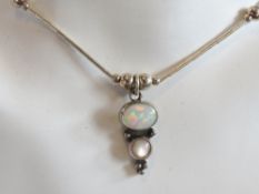 An opal and silver bead necklace in the Native American Navajo style,