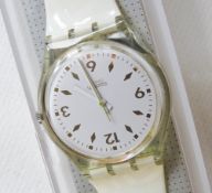 A Swatch watch in Golden Bride pattern, incorrect packaging, new battery within box.