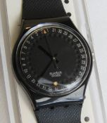 A Swatch watch in Spot Flash pattern, original packaging, new battery within box.