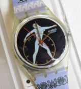A Swatch watch in Discobolus pattern, incorrect packaging, new battery within box.