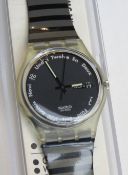 A Swatch watch in Gutenberg pattern, original packaging, new battery within box.