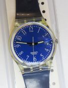 A Swatch watch in Blu-Lui pattern, original packaging, new battery within box.