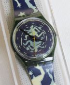 A Swatch watch in Crash pattern, original packaging, new battery within box.