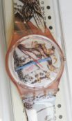 A Swatch watch in Masquerade pattern, original packaging, new battery within box.