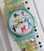 A Swatch watch in Bongo pattern, original packaging, new battery within box.