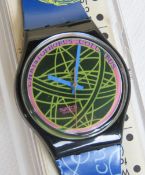 A Swatch watch in The Globe pattern, original packaging, new battery within box.