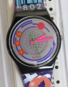 A Swatch watch in Ean Code pattern, original packaging, new battery within box.