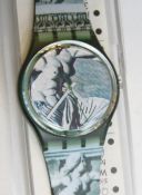 A Swatch watch in Cupydus pattern, original packaging, new battery within box.