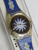 A Swatch watch in Blue Anchorage pattern, original packaging, new battery within box.