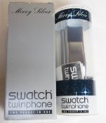 A limited edition Merry Silver Swatch twinphone, in original packaging.