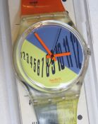 A Swatch watch in Type Setter pattern, original packaging, new battery within box.
