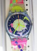 A Swatch watch in North Pole pattern, original packaging, new battery within box.