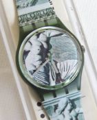 A Swatch watch in Cupydus pattern, original packaging, new battery within box.