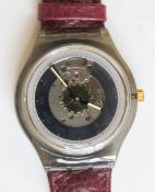 An automatic Swatch watch in Rubin pattern, within original packaging.