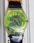 A Swatch watch in Bermudas pattern, incorrect packaging, new battery within box.