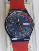 A Swatch watch in Good Shape pattern, original packaging, new battery within box.
