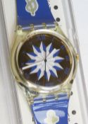 A Swatch watch in Anchorage pattern, original packaging, new battery within box.